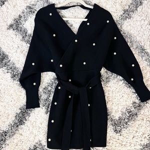 Black mini dress with white pearls